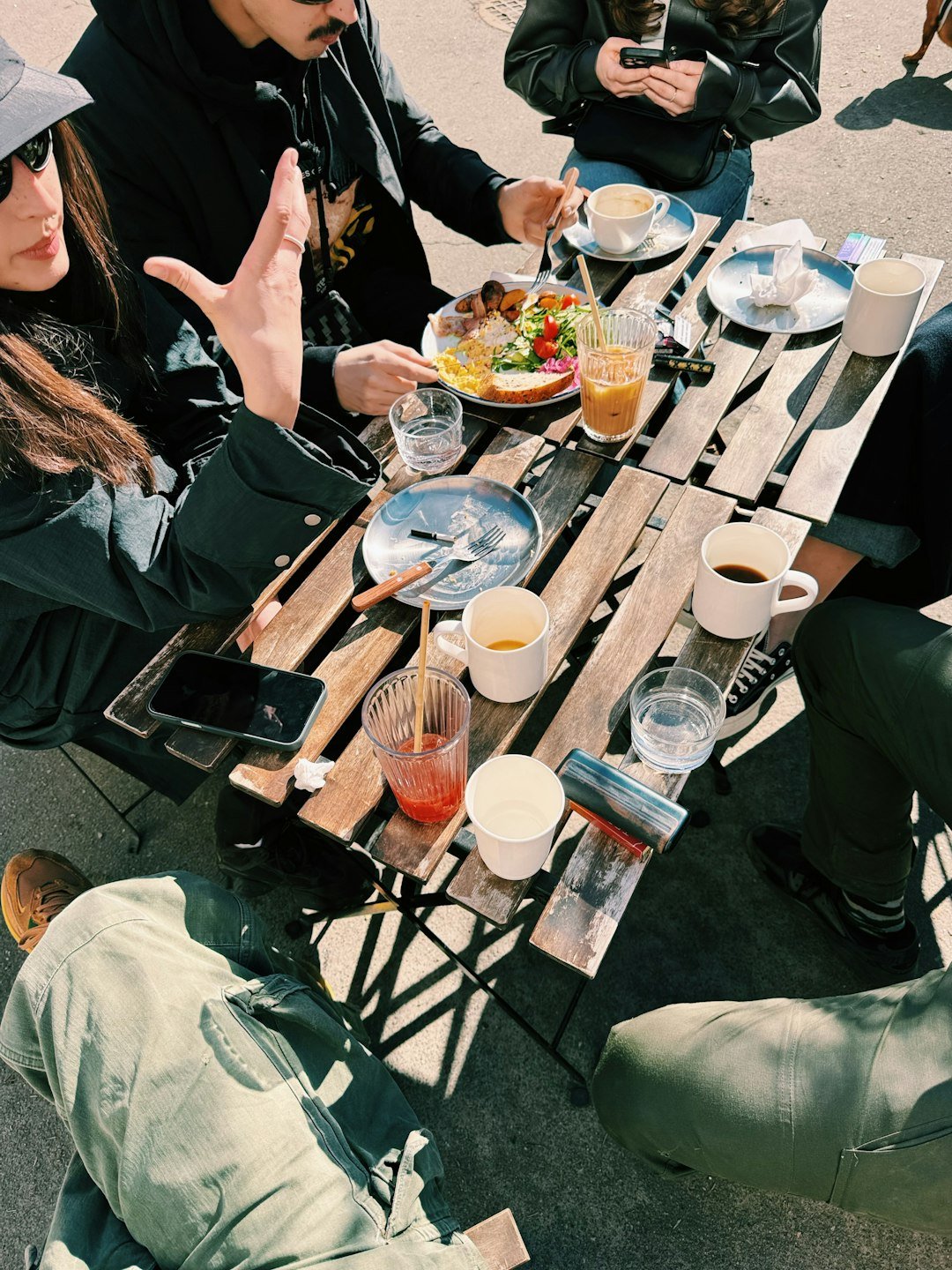 Friends enjoying a happy Saturday brunch outdoors