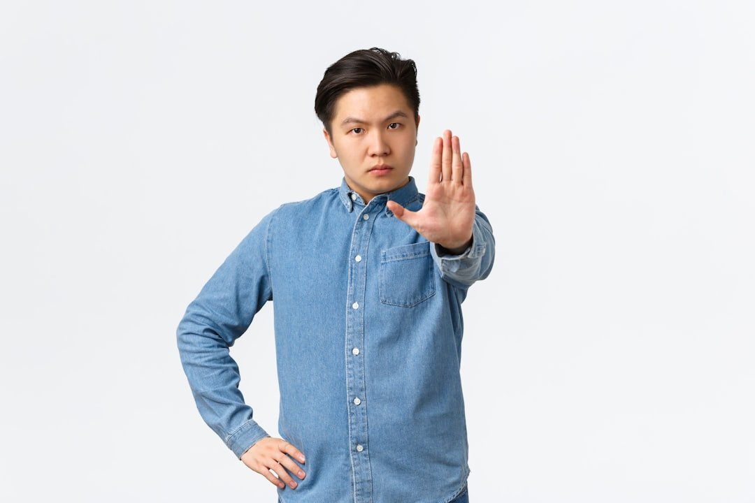 Man making a stop sign gesture, refusing or saying hell no