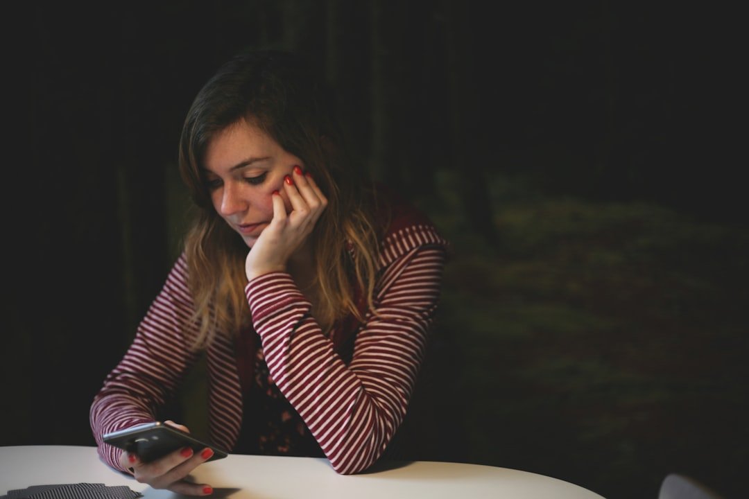 Person looking frustrated at phone, FML texting moment