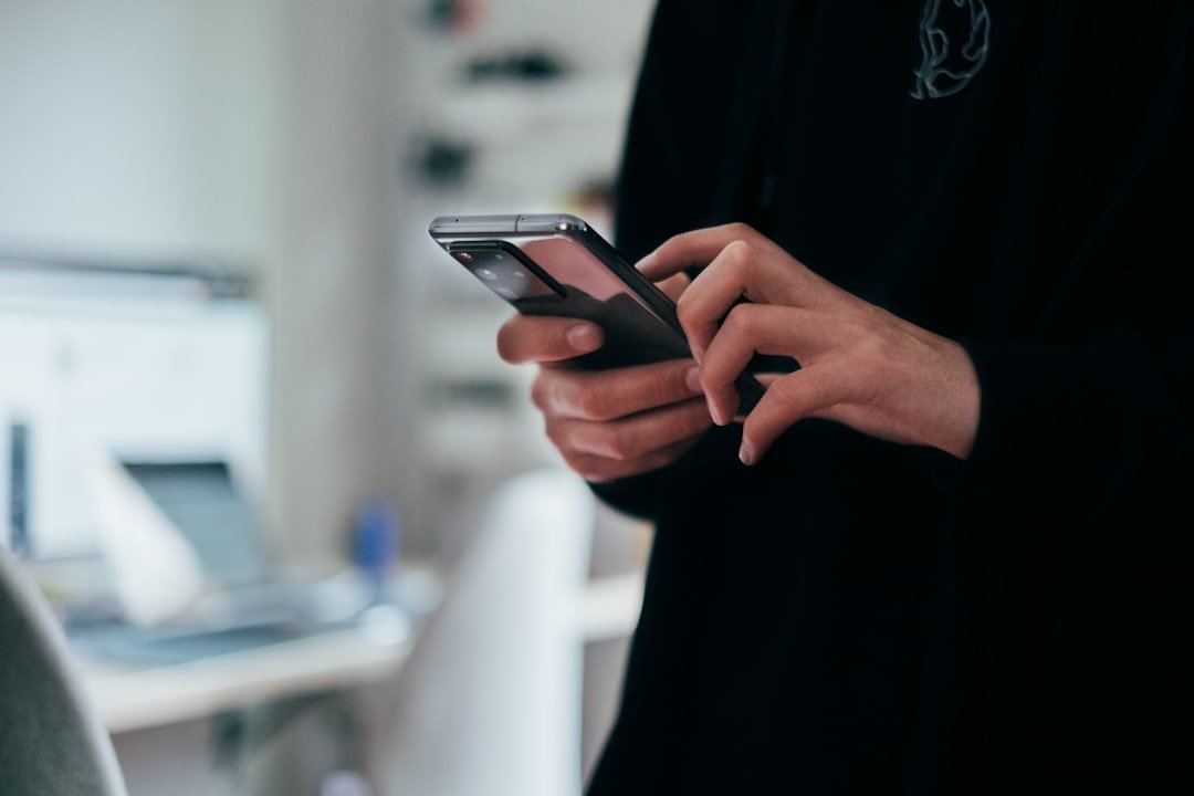 Person texting on smartphone, close up of hands