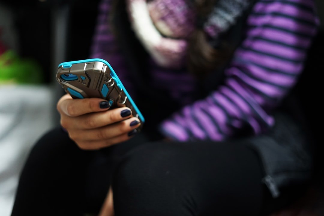 Woman using smartphone, ICL texting slang example