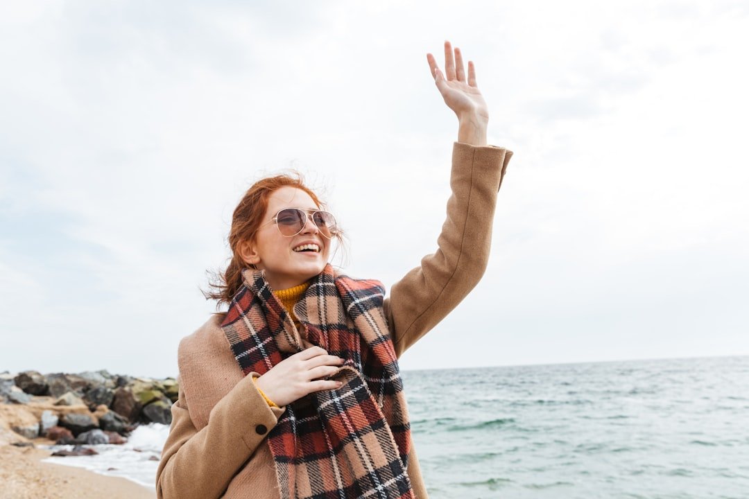 Woman waving goodbye on sunny day, have a good day alternatives